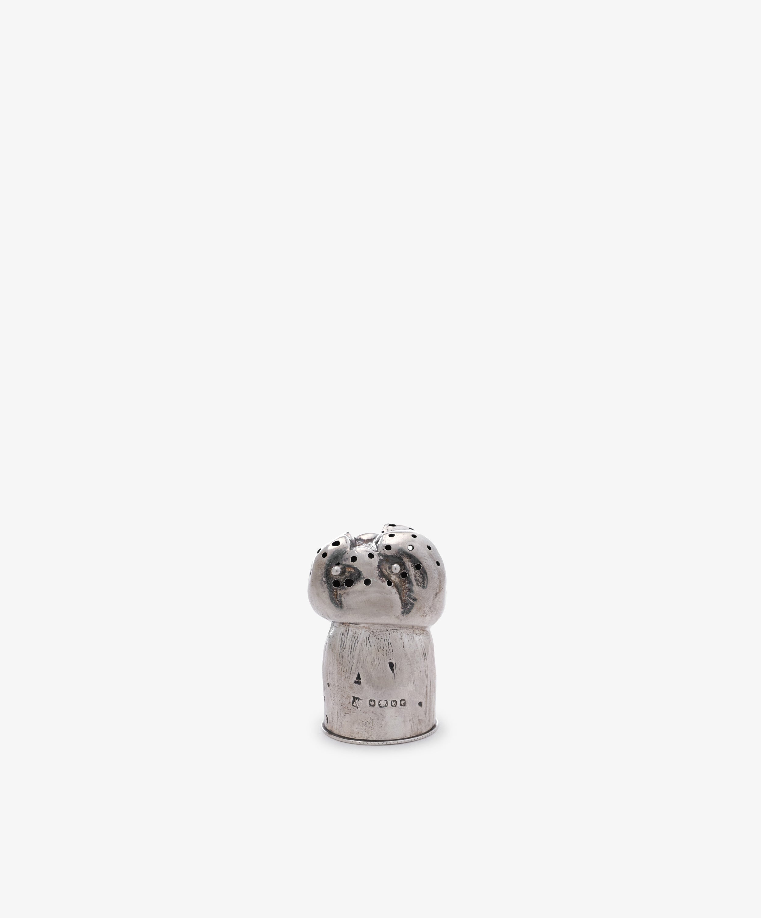 The Vintage Silver Mushroom Pepper Pot features a small, silver, mushroom-shaped design with multiple top holes. Shown against a plain white background, it makes a charming addition to any collectible tableware collection.