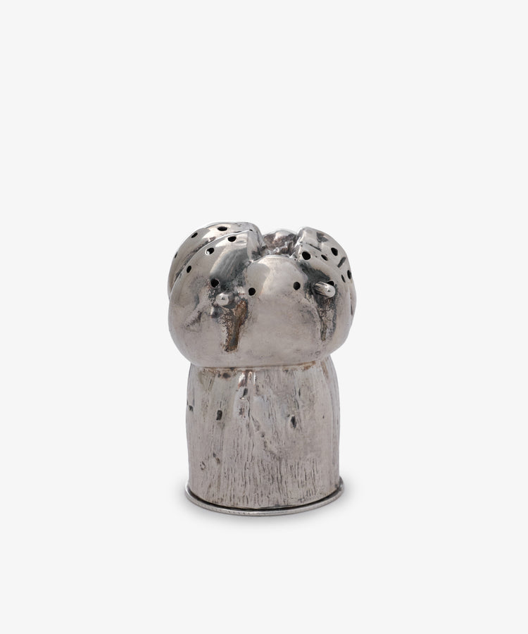 The Vintage English Silver Pepper Pot, shaped like a mushroom with small holes on top, sits against a plain white background—a charming piece of antique tableware.