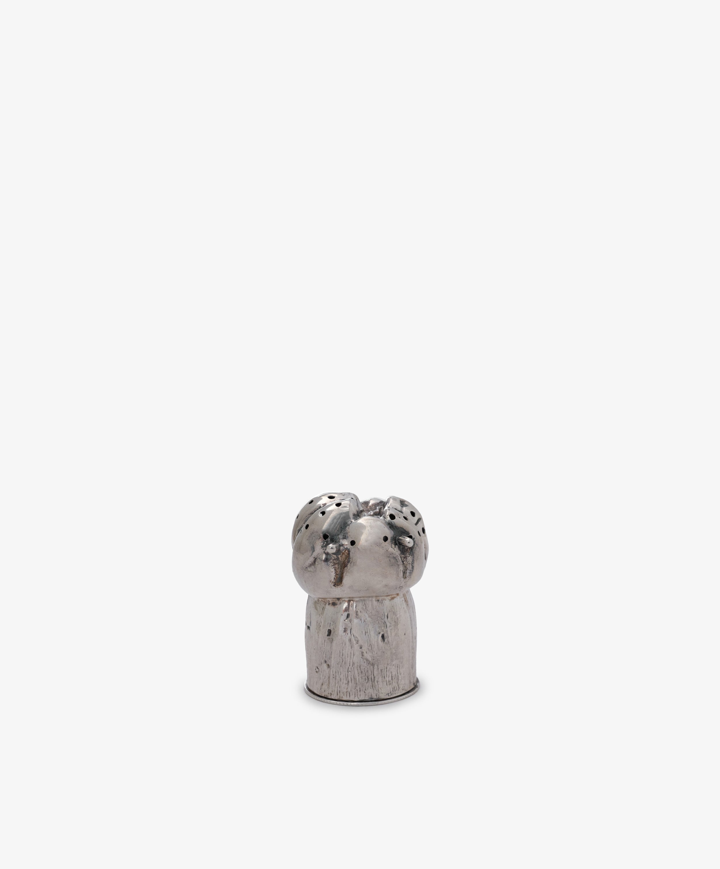 The Vintage Silver Mushroom Pepper Pot is a small, silver, cylindrical shaker with holes on top, resembling a mushroom, and is displayed against a plain white background.