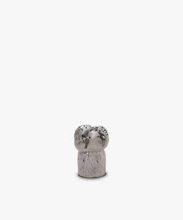 The Vintage Silver Mushroom Pepper Pot is a small, silver, cylindrical shaker with holes on top, resembling a mushroom, and is displayed against a plain white background.