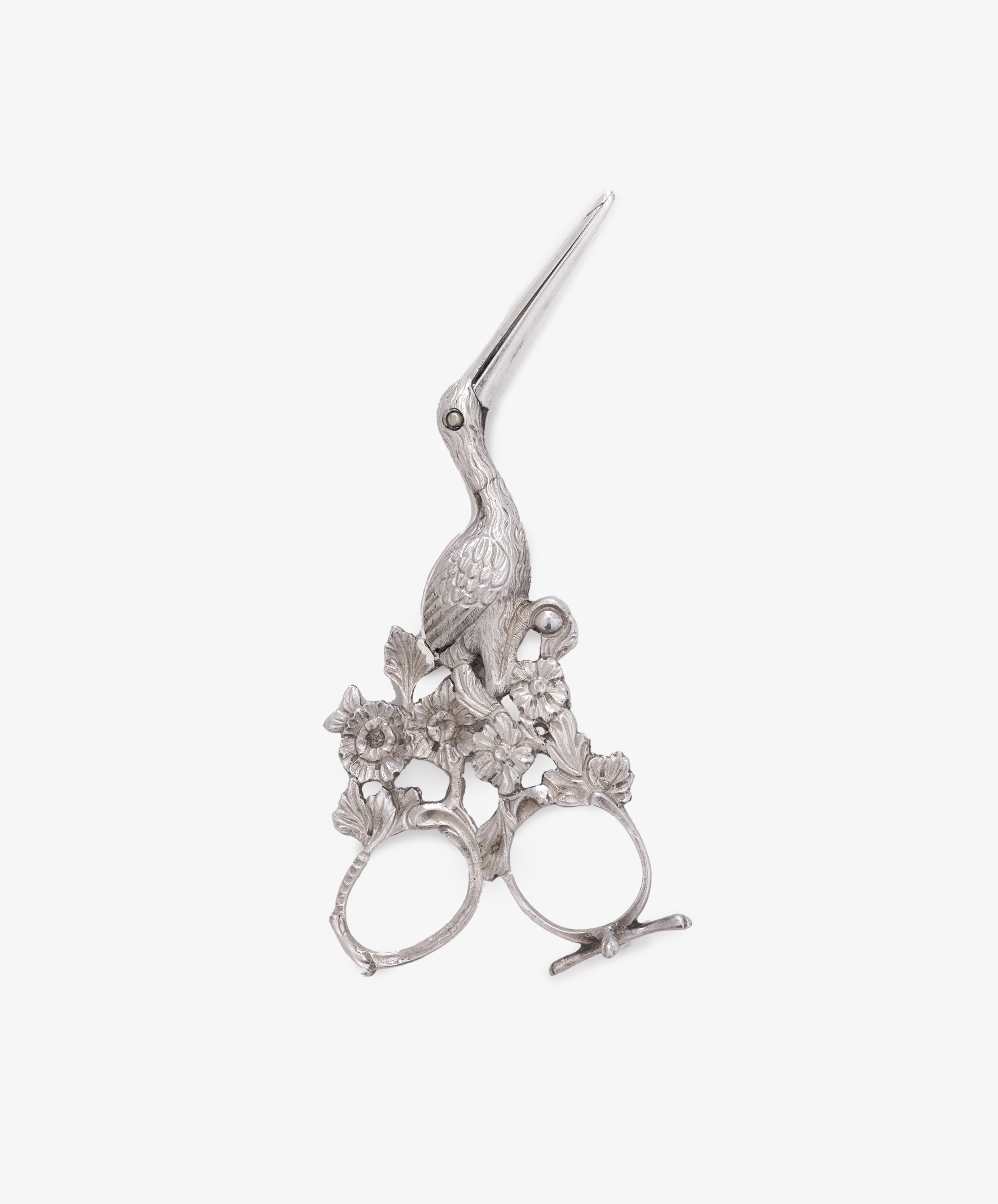 Ornate Vintage Dutch Silver Ribbon Nips—bird-shaped sewing scissors with floral detailing, two finger holes, and a slim, pointed blade.