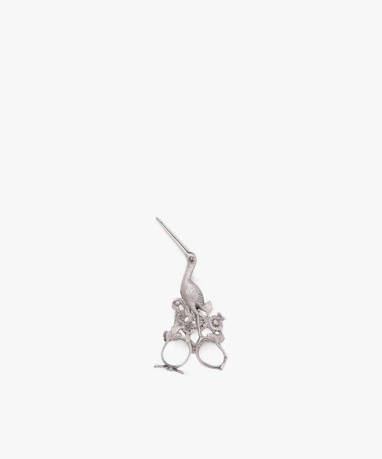 Vintage Dutch Silver Ribbon Nips, a decorative sewing tool featuring ornate floral details near the handles, is displayed against a plain white background.