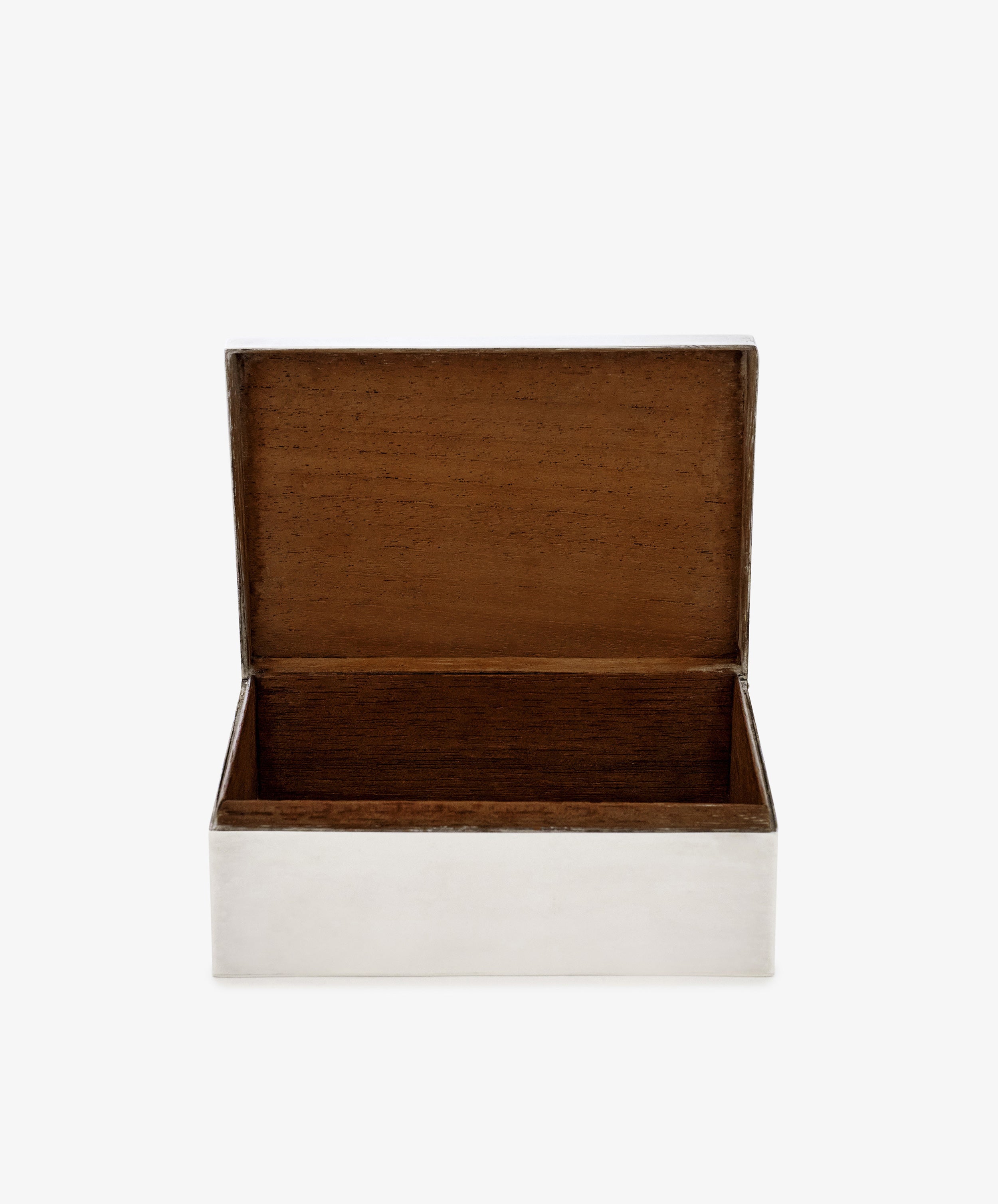 The Vintage Scottish Silver Box features a rectangular shape with a hinged lid, opening to reveal an empty wood-lined interior. Its sleek silver exterior adds an elegant touch to this classic decorative piece.