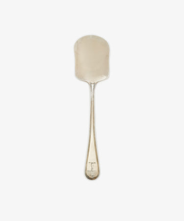A Vintage English Silver Ice Cream Spade, dated 1798, with a wide flat rounded blade and plain handle, photographed on a white background.