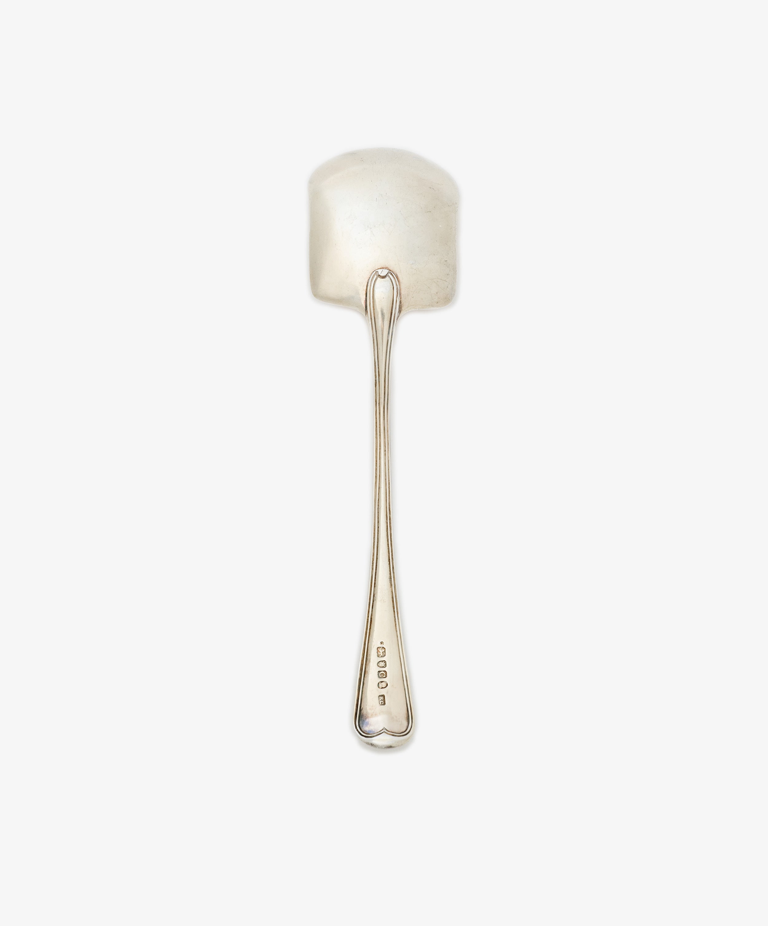 The Vintage English Silver Ice Cream Spade features a wide, flat bowl and long handle, with hallmarks near the base. Crafted in England, this elegant piece is shown on a white background.
