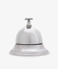 The Vintage English Silver Table Bell features a classic round base and button top, elegantly photographed against a plain white background.