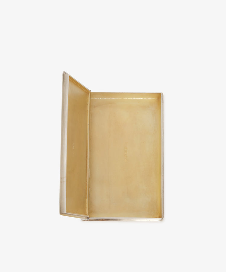 A beige open rectangular Vintage Cigarette Box Book with a hinged lid is displayed from above on a white background, evoking the look of a classic sterling silver cigarette box.