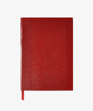 A Red Journal featuring a closed, lizard-embossed cover and matching ribbon bookmark is centered on a white background.
