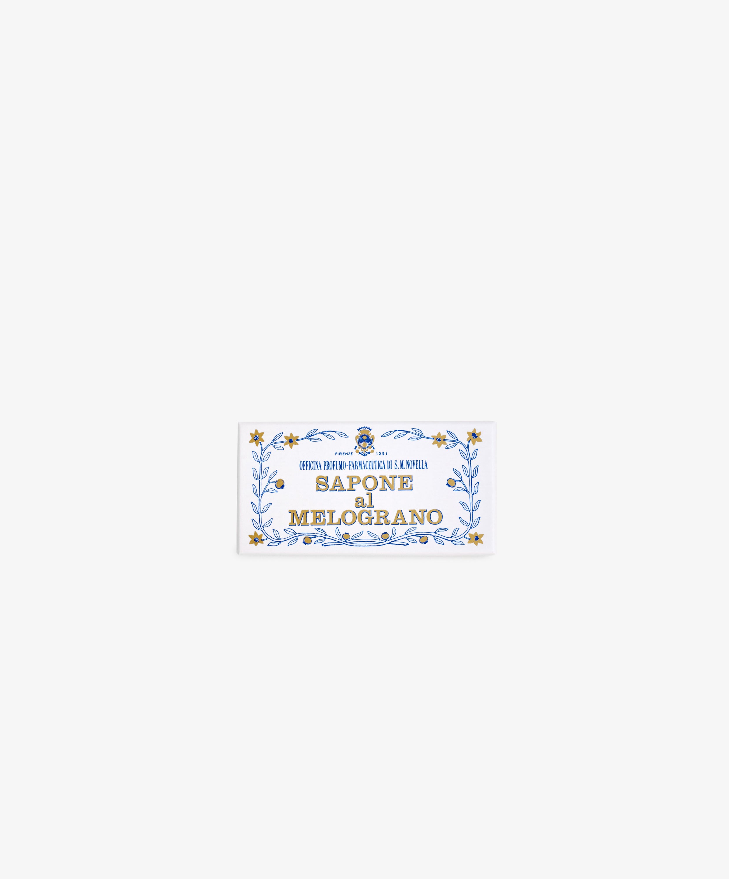 A rectangular label with a blue and gold decorative border reads Melograno Soap in bold, evoking the elegance of Santa Maria Novella’s renowned Italian soap.