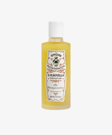 A yellow bottle of Dermoprotective Oil with a white cap and decorative label, infused with jojoba and sweet almond oil, stands against a white background—ideal for nourishing delicate skin.