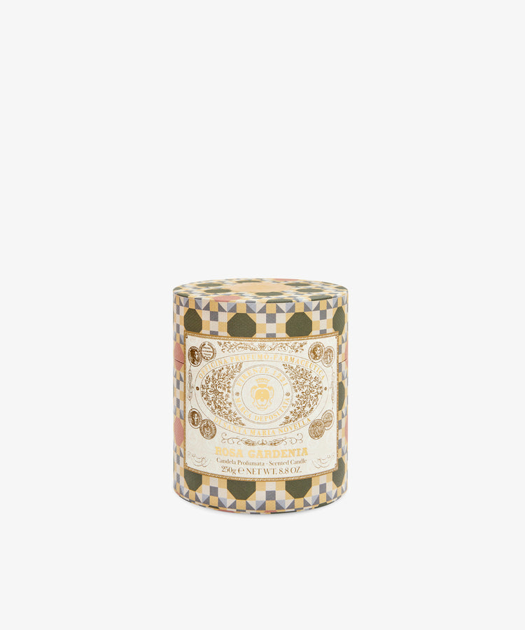 The Rosa Gardenia Candle is a decorative cylindrical container with a geometric pattern and cream label, offering a velvety fragrance in an exclusive Firenze 1221 Edition.