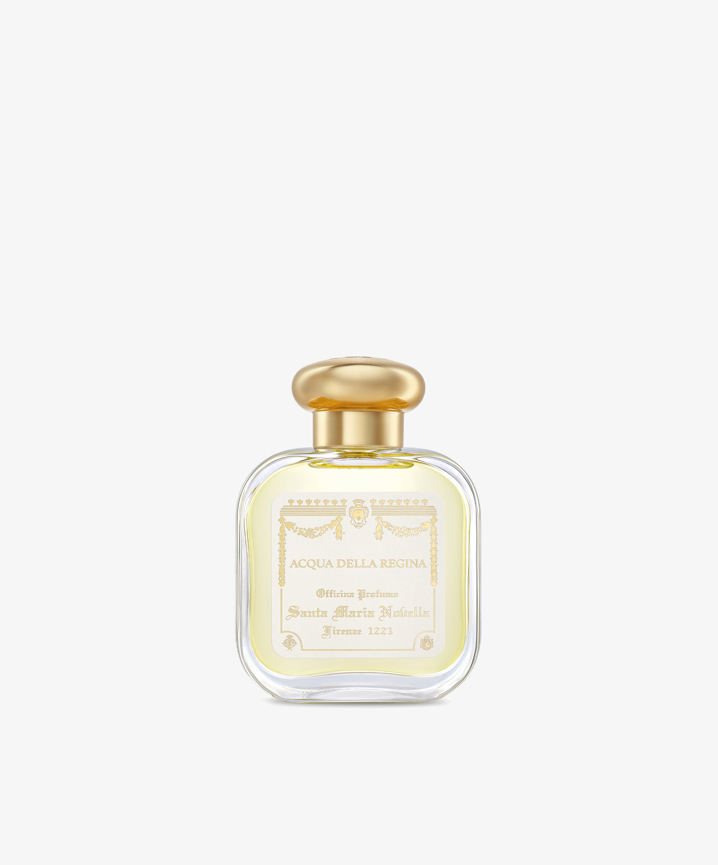 A clear glass bottle of Acqua Della Regina Eau de Cologne, a historic scent, features a gold cap and cream label with gold lettering and decorative accents.