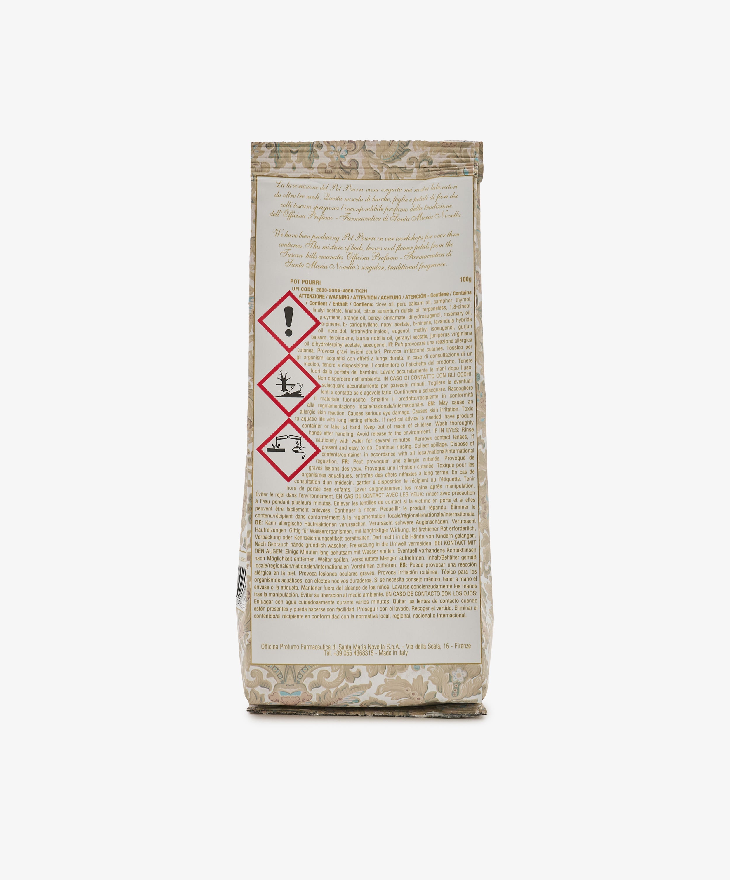 Back of a Pot Pourri Bag in beige patterned packaging, featuring warning symbols for health, flammability, and environmental hazards; most of the surface is covered with text, characteristic of scented sachets or closet fresheners.