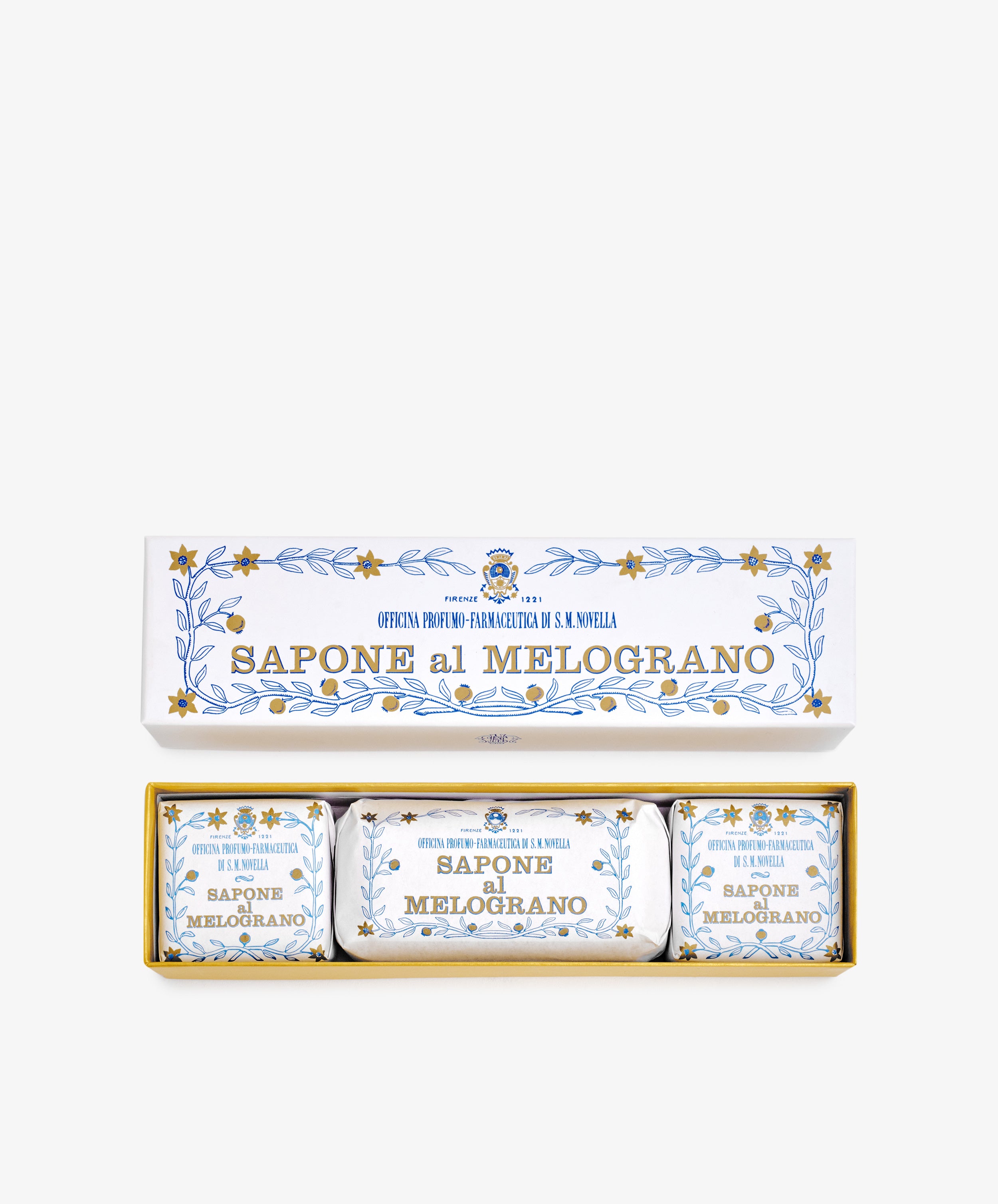 The Melograno Soap Set features three wrapped soaps labeled “Sapone al Melograno” in packaging adorned with blue and gold floral patterns inspired by Florentine paper.