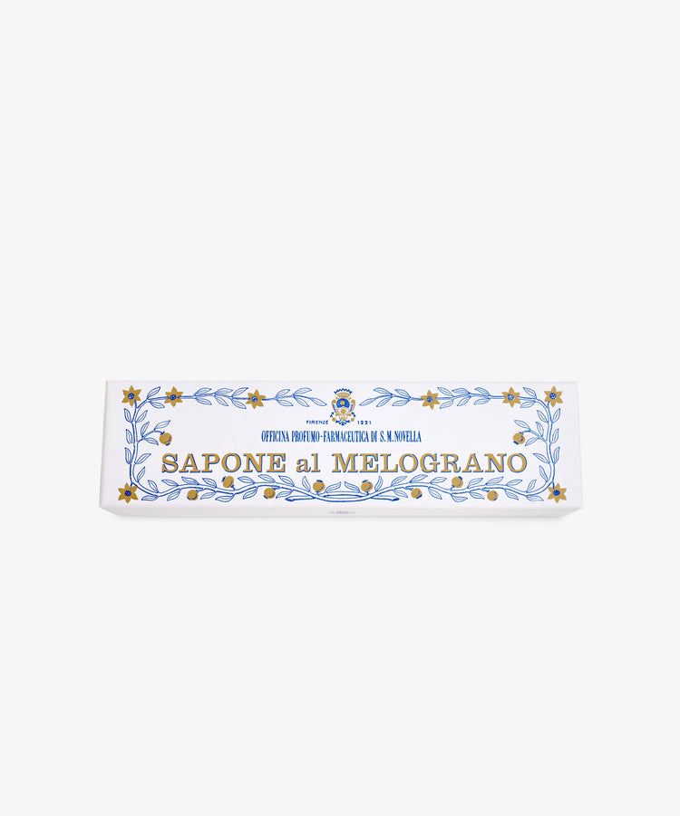 The Melograno Soap Set features rectangular bars labeled SAPONE al MELOGRANO, adorned with gold stars and blue leaf patterns inspired by Florentine paper on a white background.