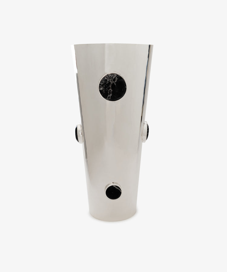Paros Cone Vase—tall and silver-colored, crafted from steel, features three black circular accents aligned vertically and two on each side, displayed against a plain white background.