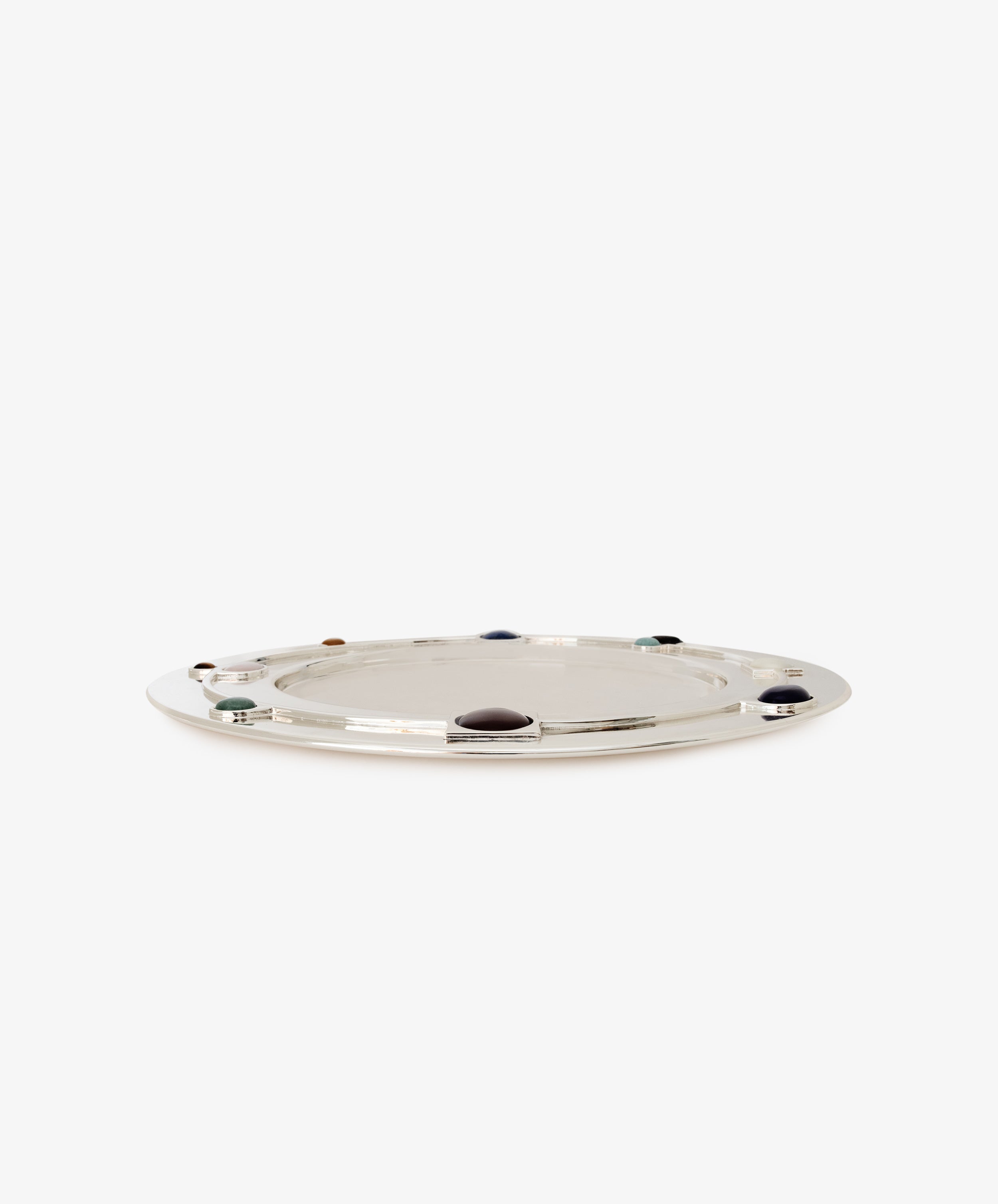 Verola Round Tray: A shiny silver tray with a flat surface, featuring beautifully crafted colored stone rings spaced evenly along the rim, displayed on a plain white background.