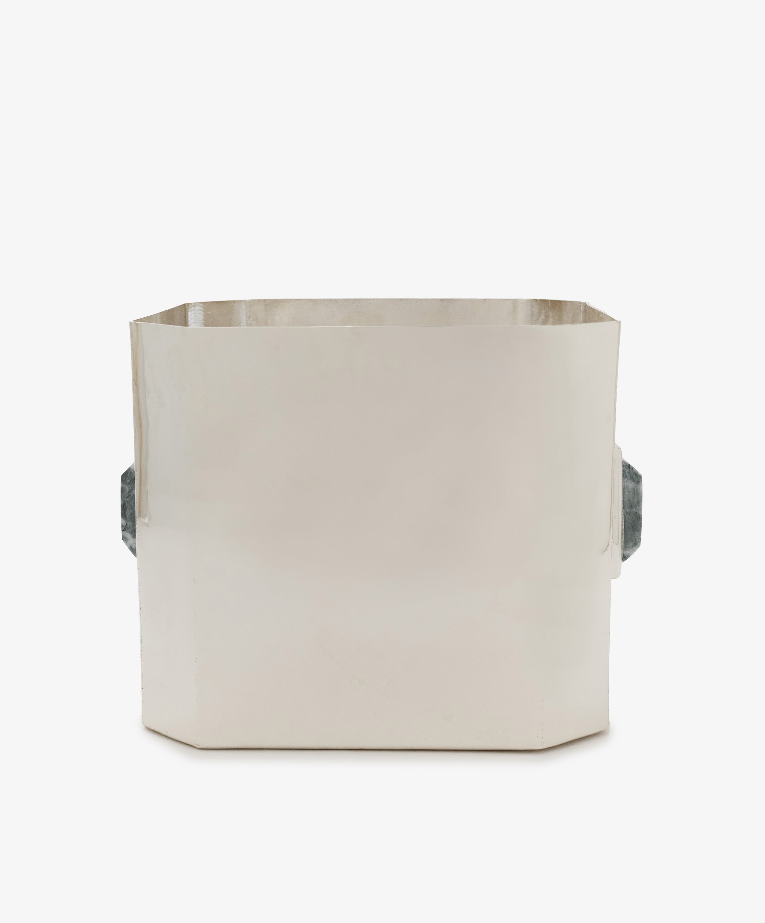 The Paros Square Vase is a rectangular, silver-plated brass container featuring two dark, textured side handles, displayed against a plain white background.