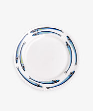 The Tommaso Dinner Plate, Set of 4, features white ceramic plates with hand-painted blue and black fish around the rim—ideal for fans of sardine-themed designs or anyone seeking vibrant summer tableware.
