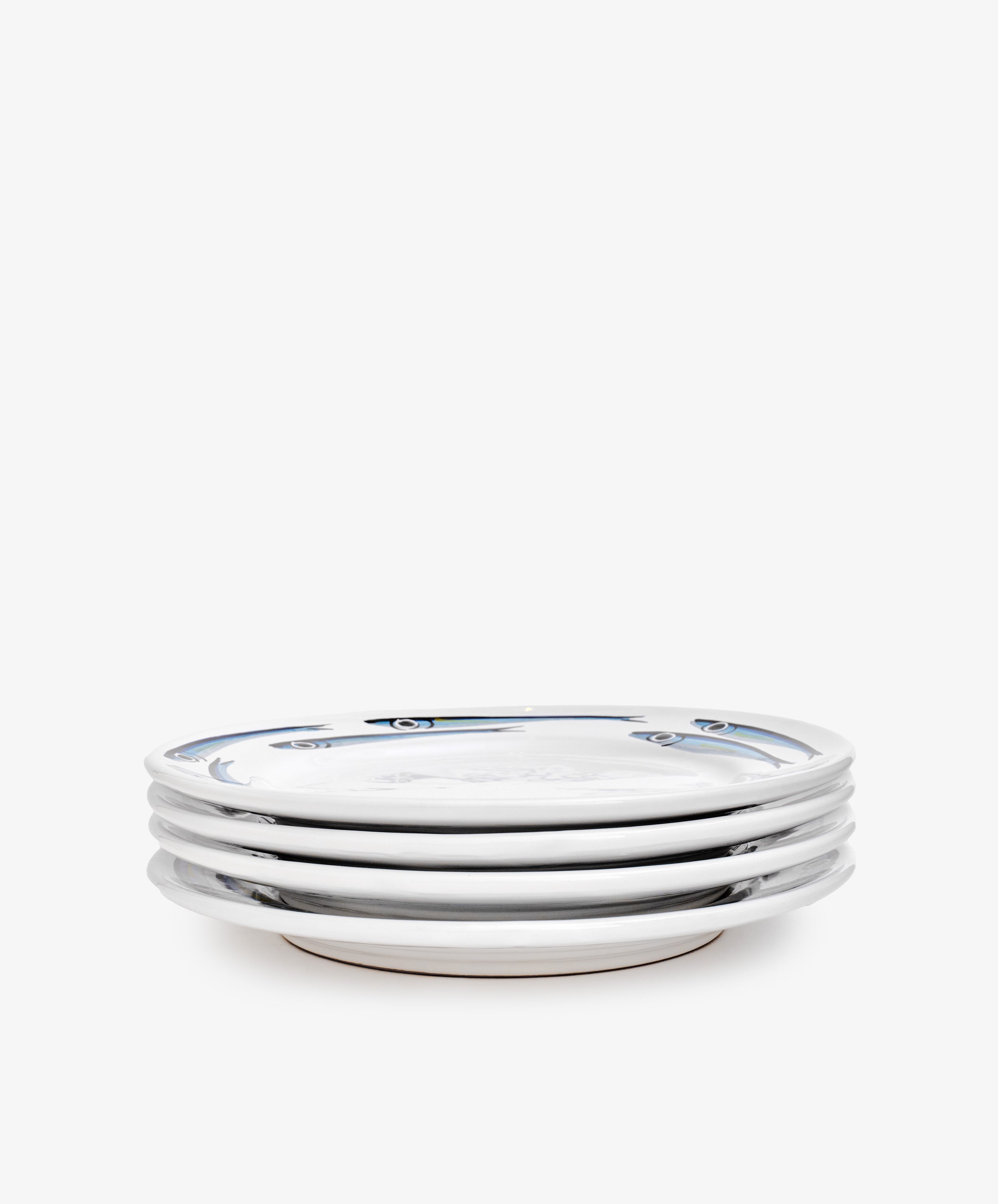 A set of four Tommaso Dinner Plates in white ceramic featuring a minimal blue rim pattern, stacked together on a plain white background.