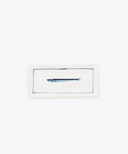 The Tommaso Rectangle Tray is a white ceramic serving tray featuring a simple illustration of a small cobalt blue fish in the center, framed by a thin blue border.