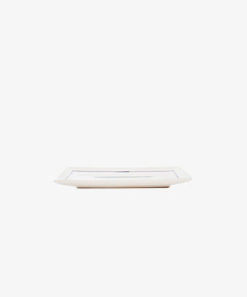 Tommaso Rectangle Tray, a rectangular white ceramic serving piece with a thin cobalt blue border and hand-painted delicate details, shown from the side against a plain white background.
