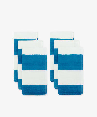 Striped Napkins by Summerill & Bishop. Two rows of three white linen napkin with thick blue stripes.