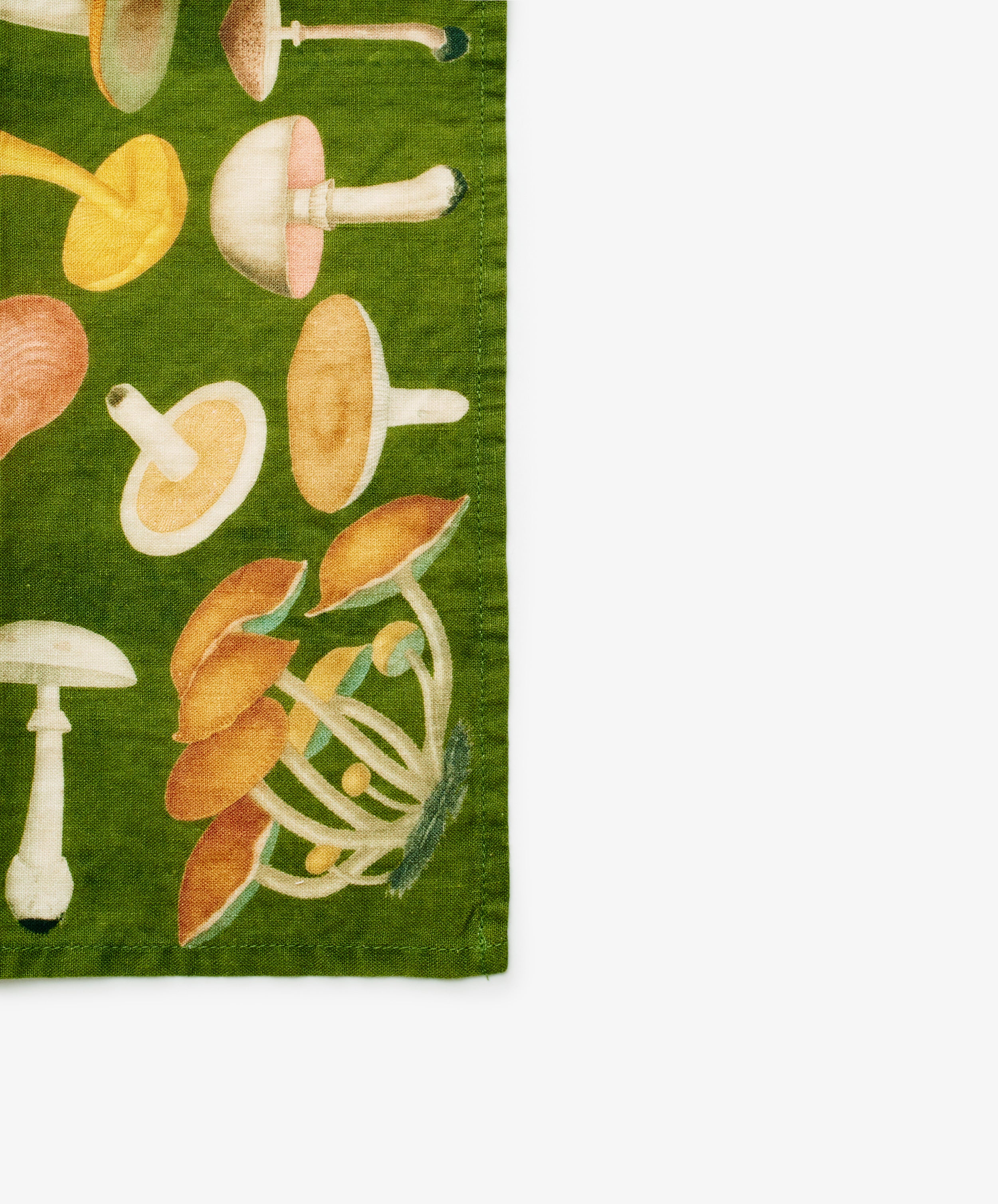 John Derian Fungi Napkin. Set of six napkins with mushroom motif. Close up of corner.