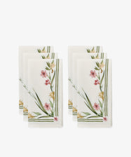 Set of 6 Gladioli Napkins—white cloth with pink, yellow, and green botanical gladioli patterns and green striped borders—arranged in two stacks. Ideal for vibrant table decor or pairing with a matching tablecloth.