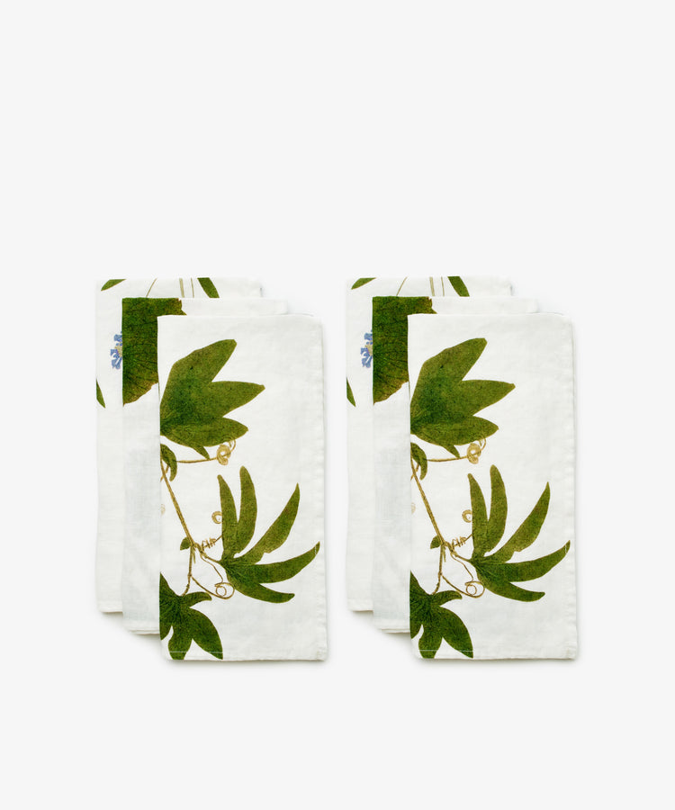 Tisane Herb Napkins. Set of six napkins with a green vine pattern. Front view.