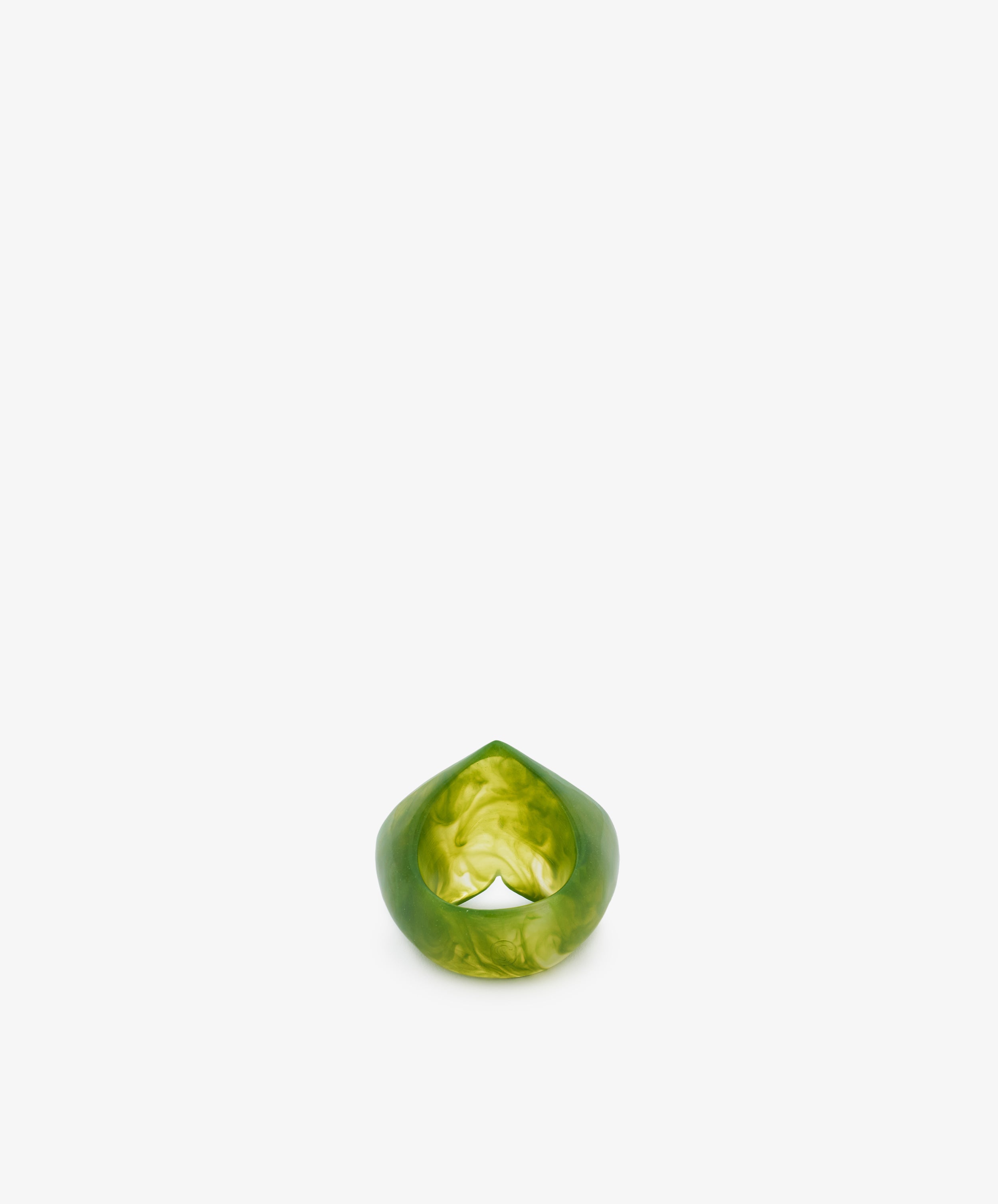 A green, marbled resin ring with a smooth, rounded shape and sculptural form, displayed upright on a plain white background.