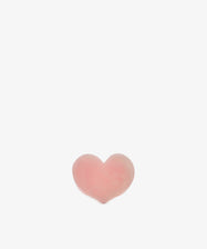 A small, pink Heart Resin Napkin Ring is centered on a plain white background.