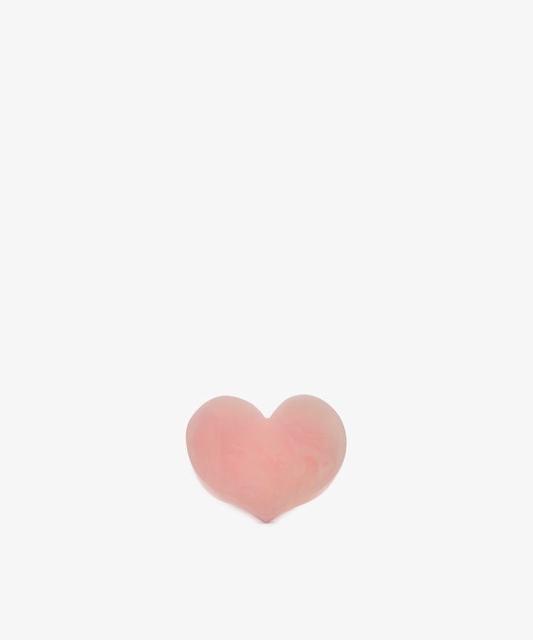 A small, pink Heart Resin Napkin Ring is centered on a plain white background.