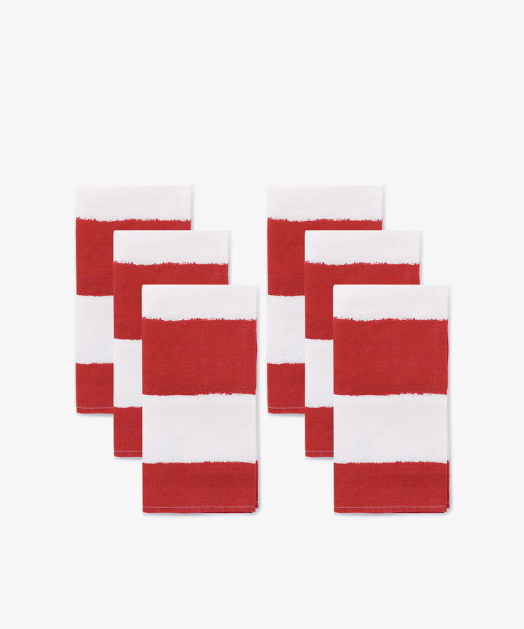 A set of six Striped Napkins, featuring bold white and red stripes, are arranged in two rows on a white background.