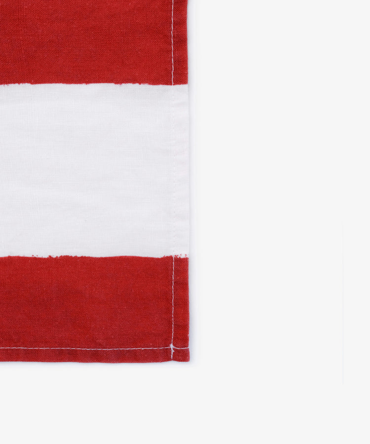 A set of 6 Striped Napkins featuring horizontal red and white stripes with a stitched edge, reminiscent of Summerill & Bishop designs, displayed against a white background.