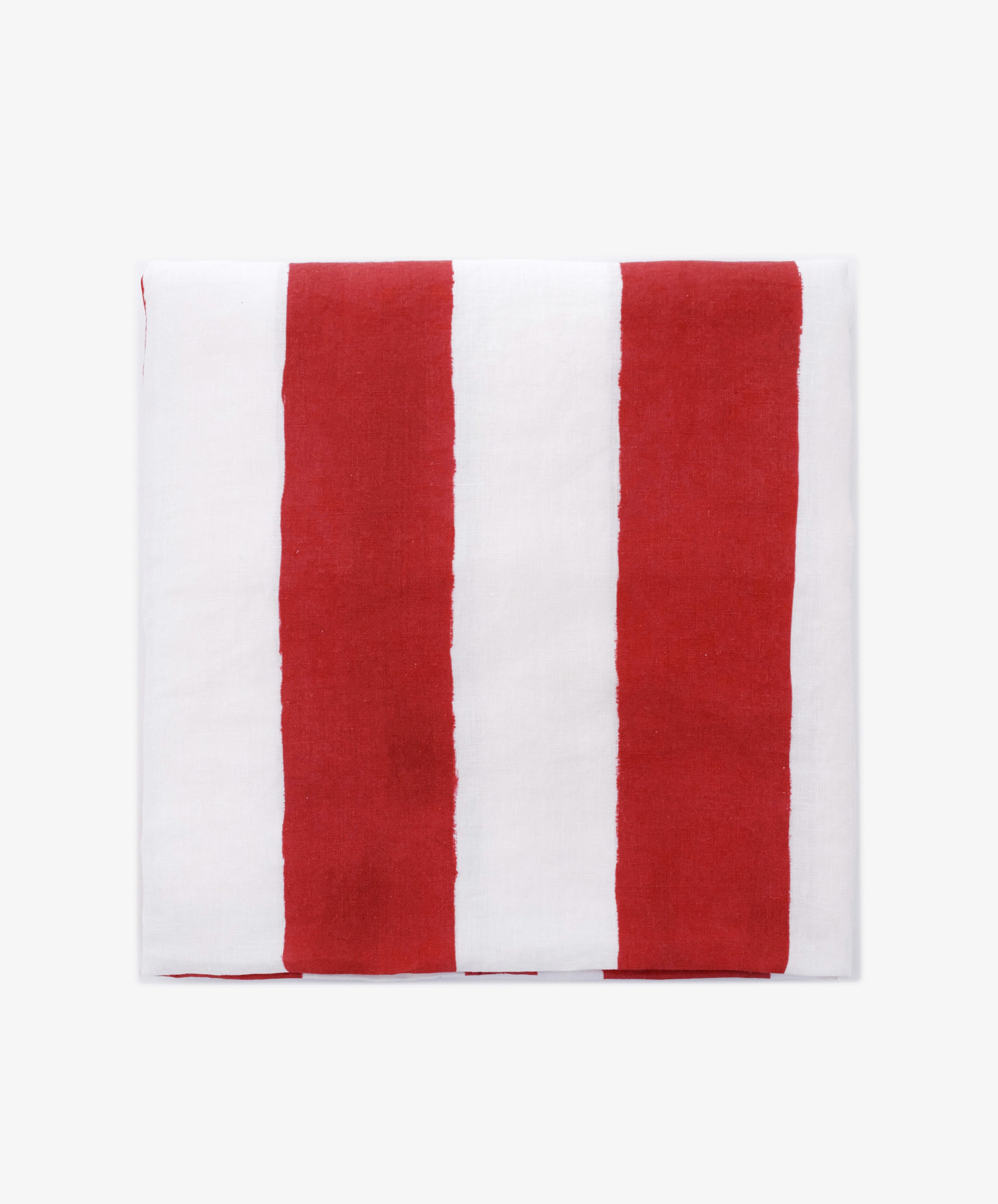 A neatly folded Striped Tablecloth by Summerill & Bishop, displaying vertical red and white stripes on a plain white background.
