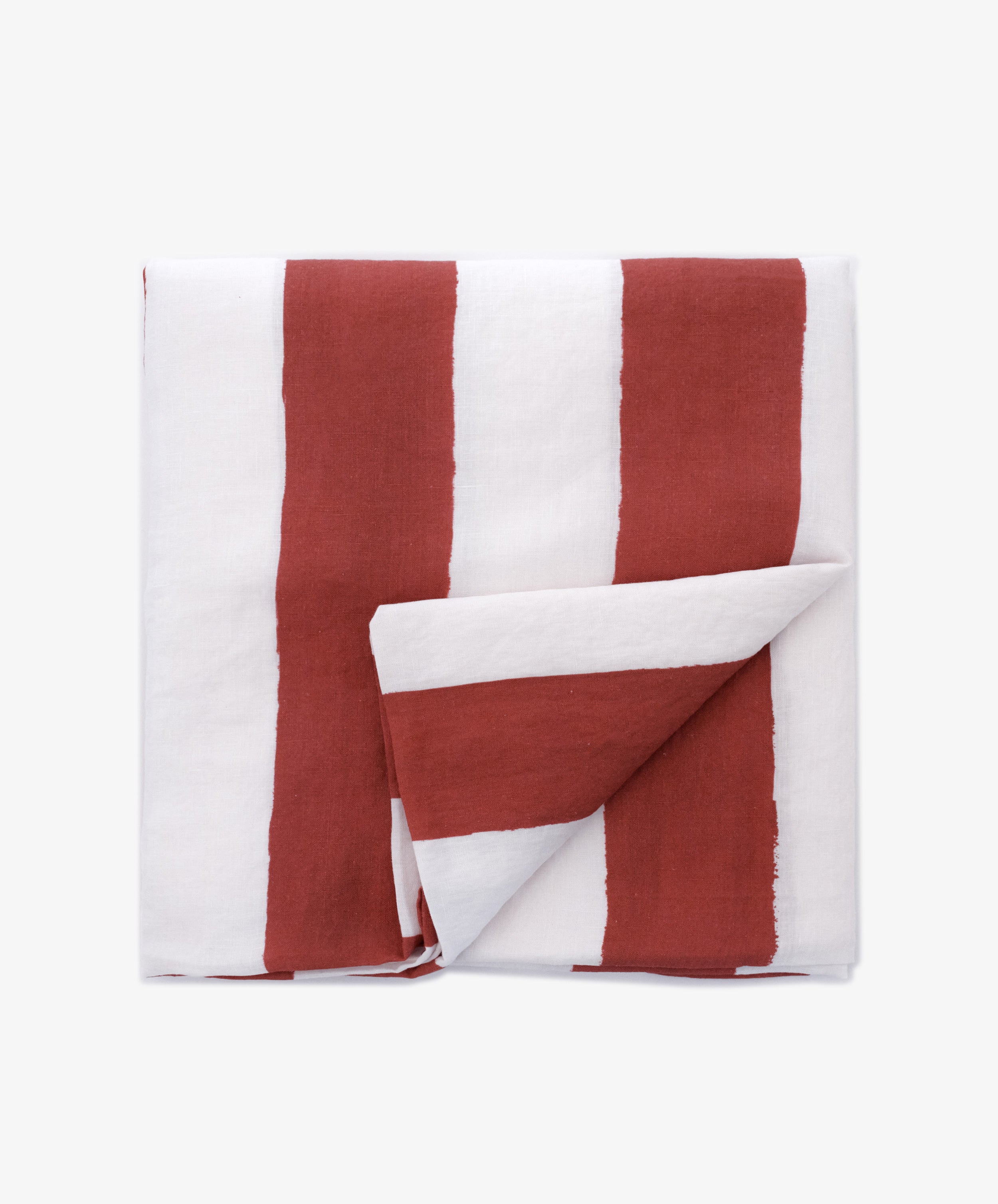 The Striped Tablecloth features bold vertical red and white stripes and is shown neatly folded against a plain light background.