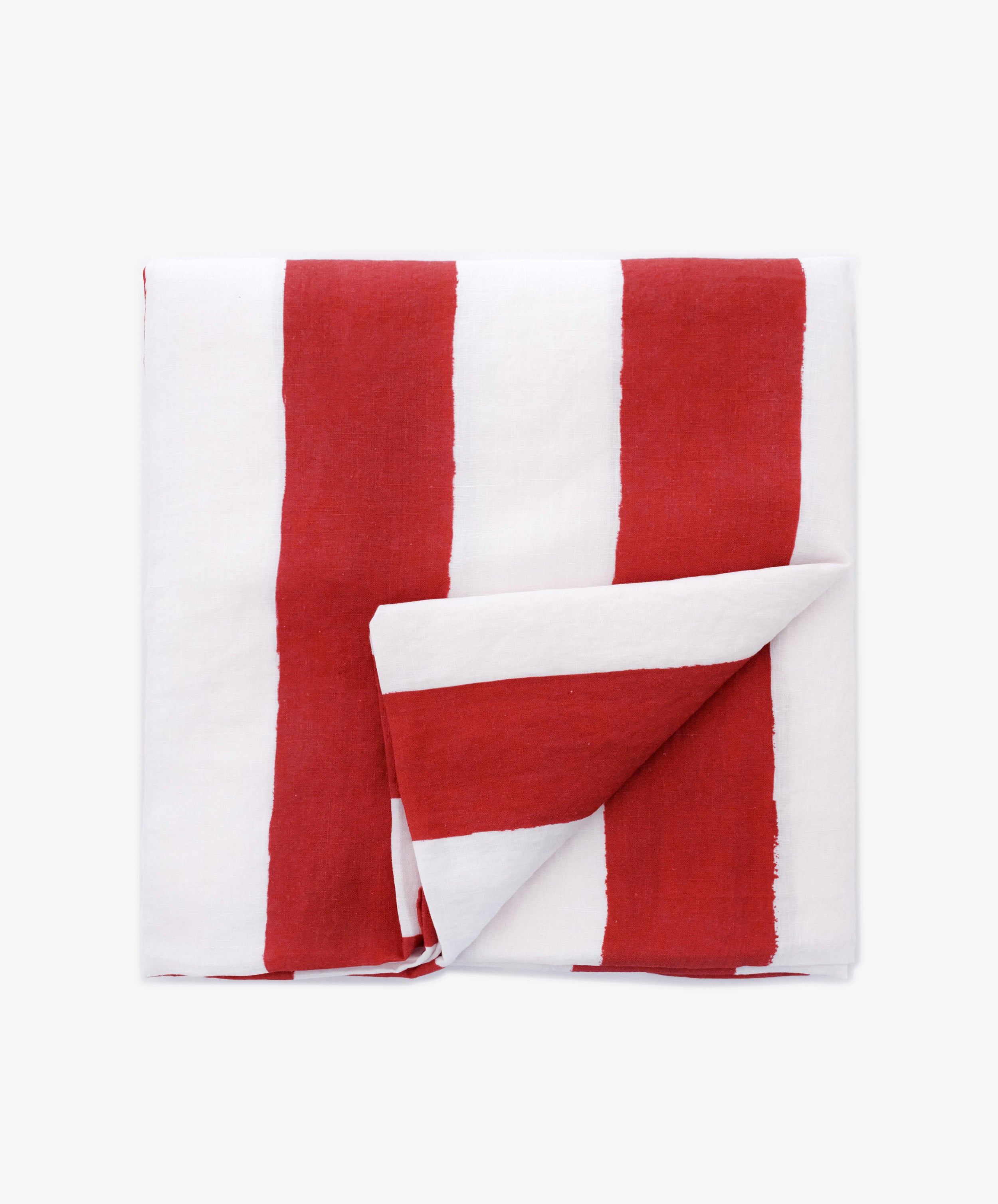 A Striped Tablecloth with bold vertical red and white stripes is neatly folded and displayed on a light background.