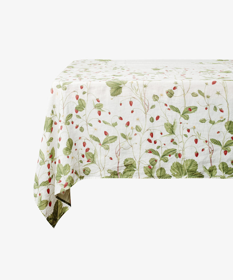 Fraise de Bois tablecloth. Ghost imagery of tablecloth draped over table. Side view.