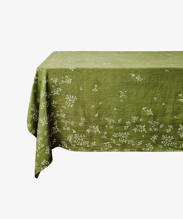 S&Bee Tablecloth. Ghost image of tablecloth draped over a table. Side view.