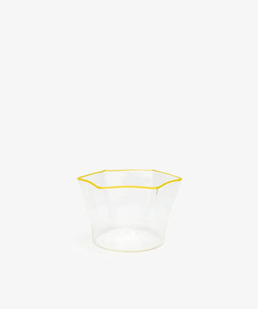 Gustavo Snack Bowl. Hexagonal bowl in clear glass with yellow stripe at top lip.