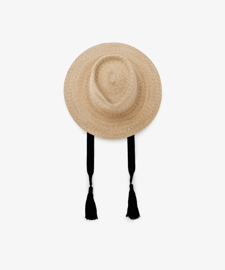 The Wosto Hat is a Mediterranean-style field hat with a wide brim for superb sun protection. It has two long black chin straps ending in tassels and is displayed against a plain white background.