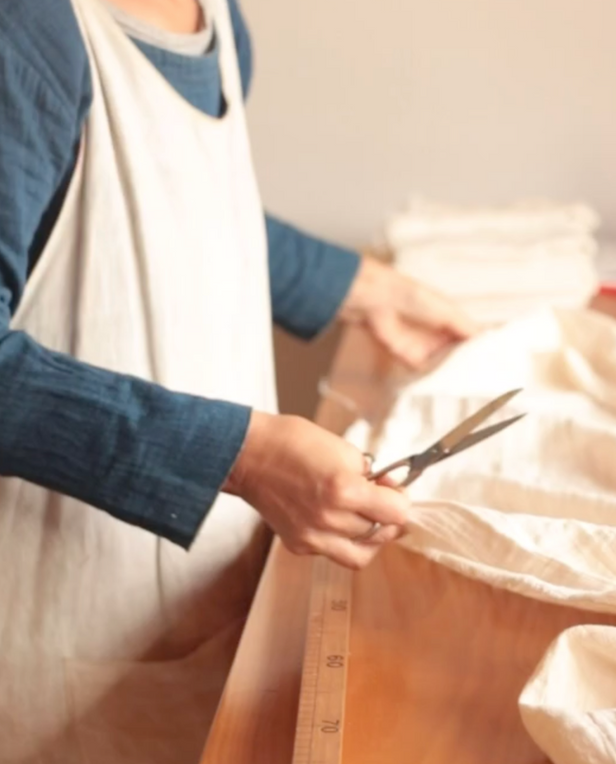 woman cutting fabric