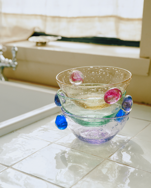 stack of glass bowls in colorful tones
