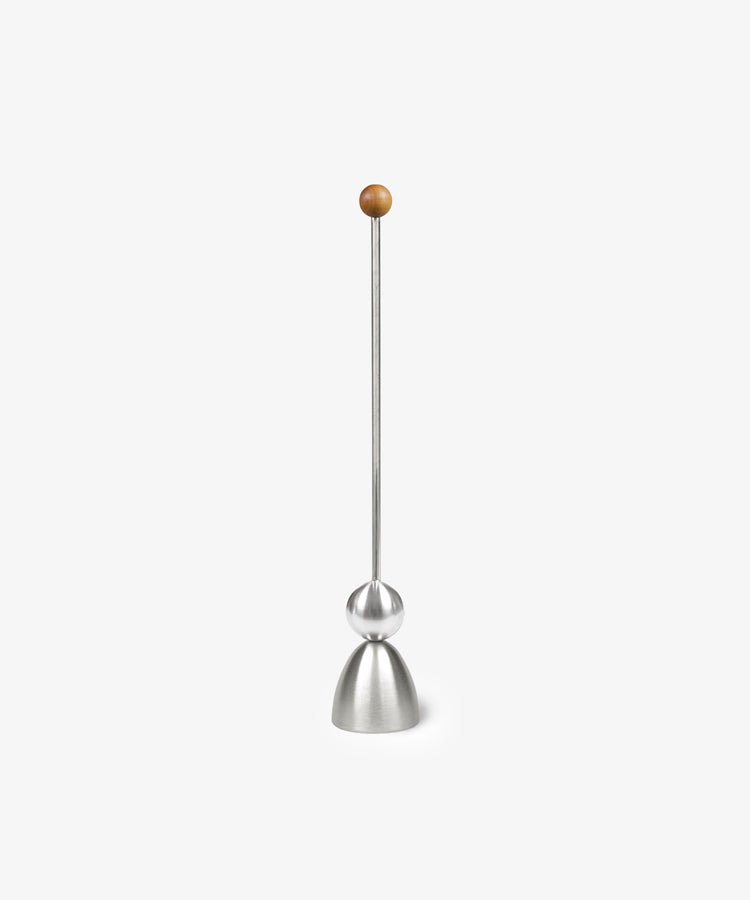 The Clack Egg Opener, a German-engineered tool with a conical base, spherical center, long rod, and wooden top sphere, is shown against a white background.