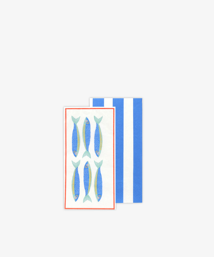 Pesce Long Lunch Paper Napkins: one napkin with blue and white stripes, the other with six blue sardines on a white background and red border—ideal for bringing Mediterranean charm to your table.
