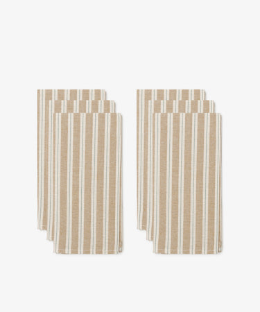 Six Martin Striped Napkins, featuring classic beige and white vertical stripes, are arranged in two stacks of three against a white background.