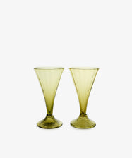 Vittoria Champagne Glass. Pair of smoke-green stemless glasses with swirls at bottom.