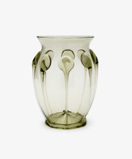 The Carlotta Vase is a handcrafted mouth-blown piece that features a unique design, exemplifying the timeless beauty and elegance of Bohemian artistry.