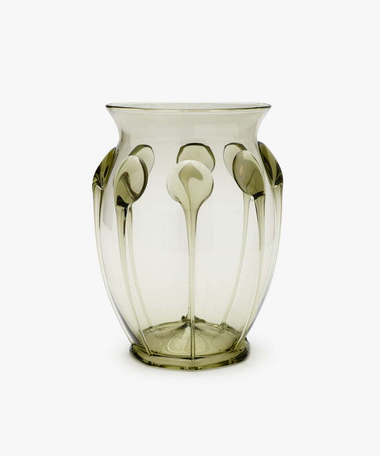 The Carlotta Vase is a handcrafted mouth-blown piece that features a unique design, exemplifying the timeless beauty and elegance of Bohemian artistry.